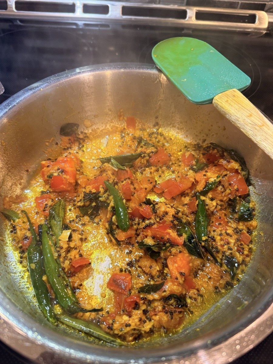 Tomatoes cooking in tarka